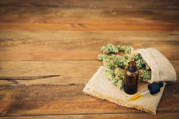 Ocimene bud next to dropper